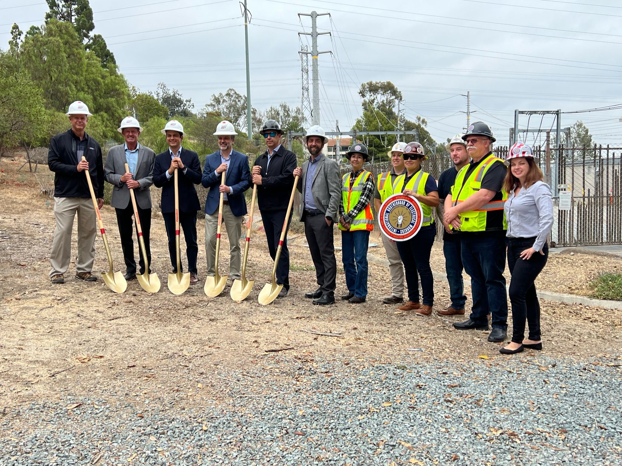 Photo of SDGE employees standing near the New 40 MW energy storage facility to open in Fallbrook.